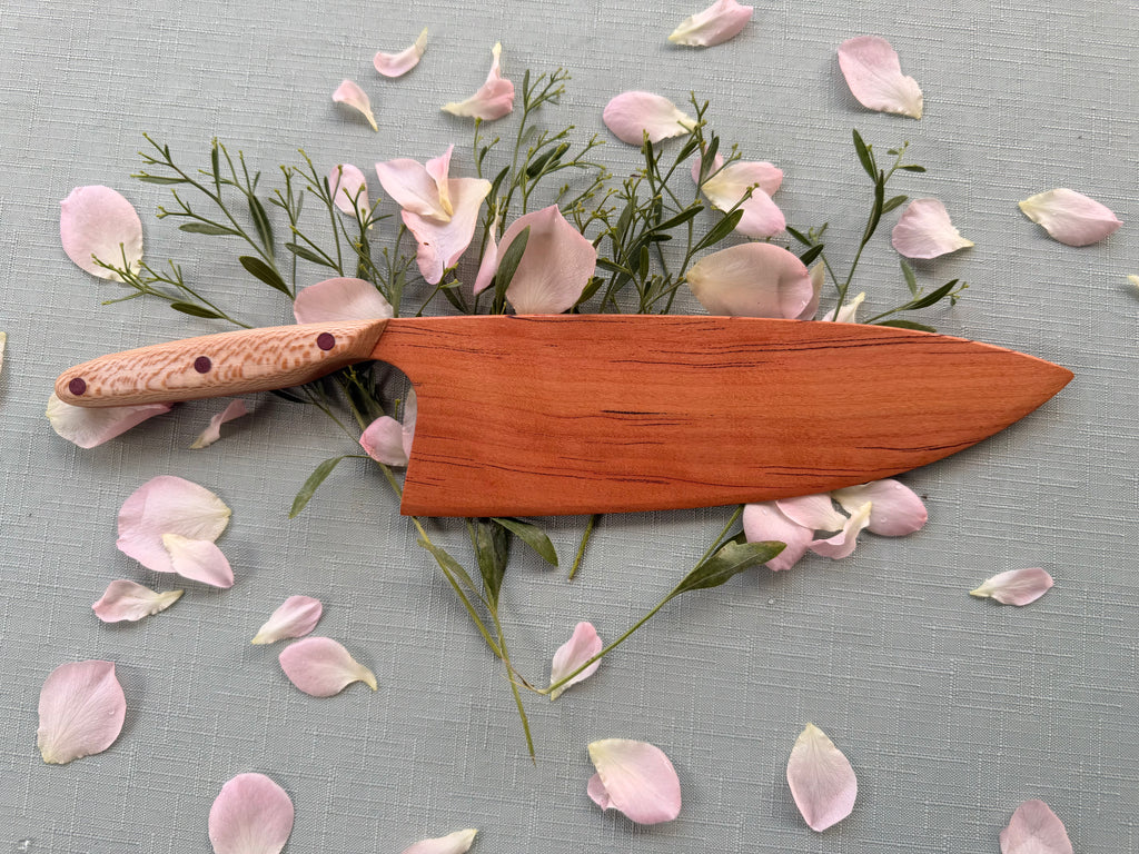 Blacklined cherry serving knife.