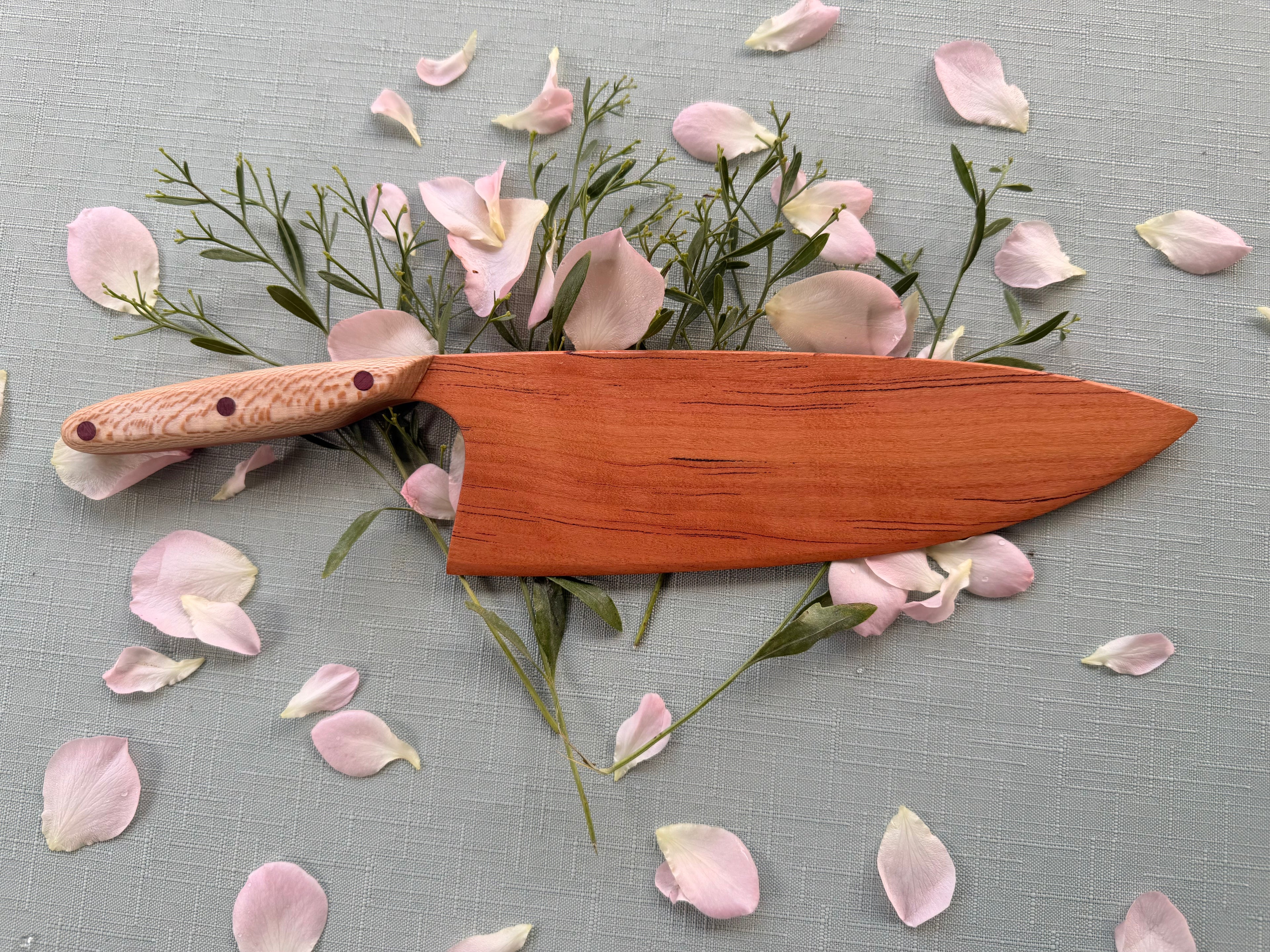 Blacklined cherry serving knife.