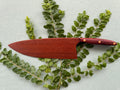 Exotic leopard wood serving knife.