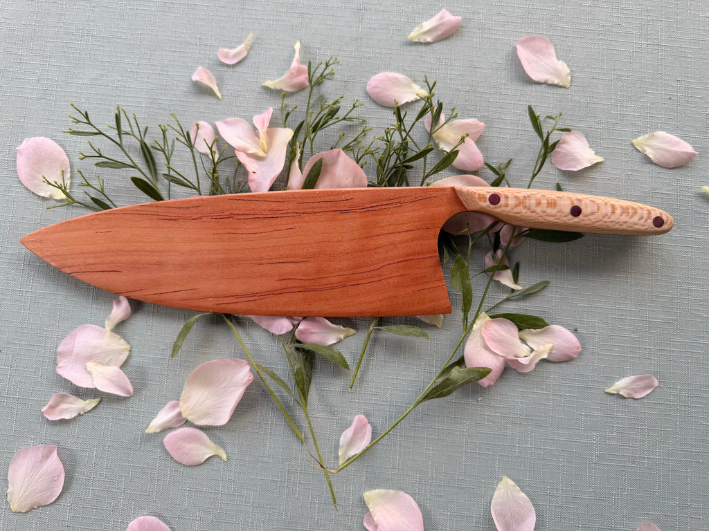 Blacklined cherry serving knife.