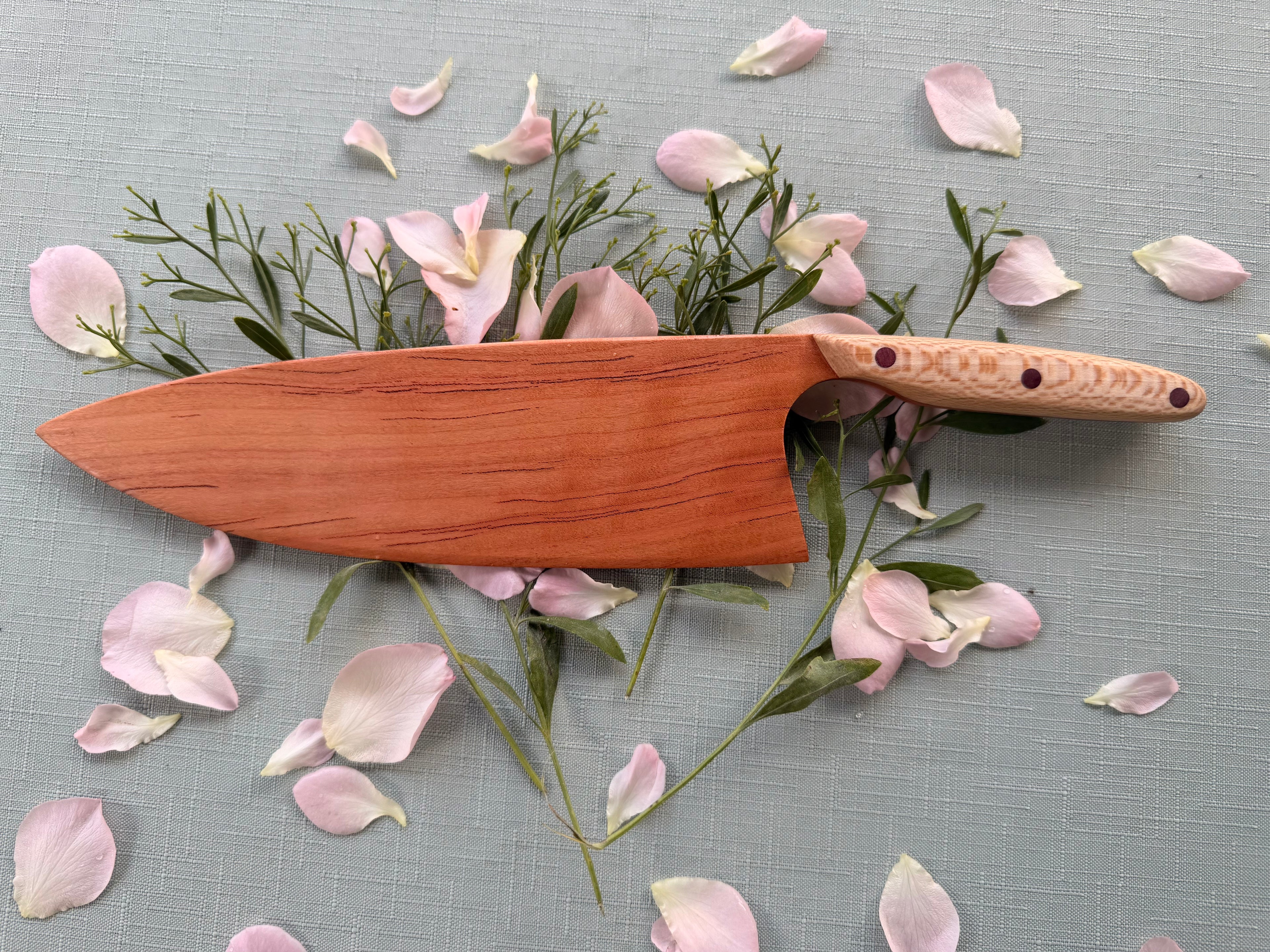 Blacklined cherry serving knife.