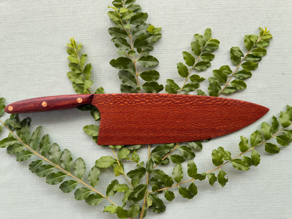 Exotic leopard wood serving knife.