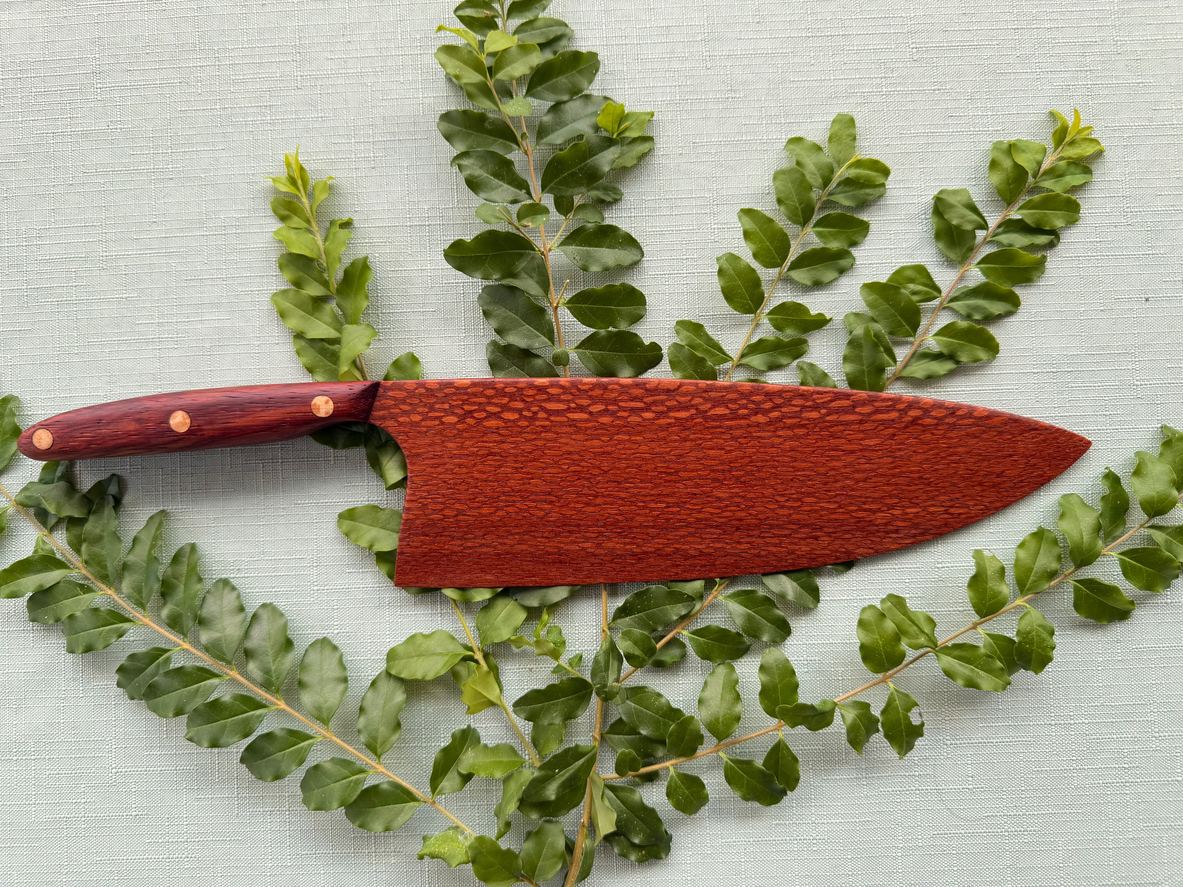Exotic leopard wood serving knife.